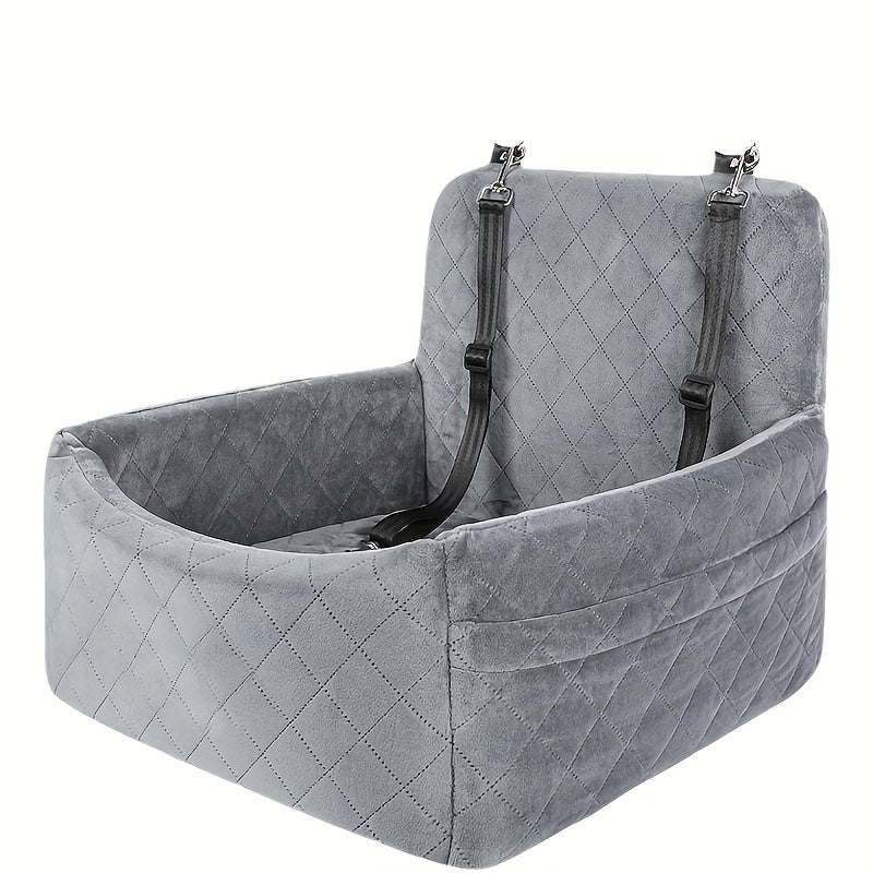 En grå hundesæde i bilen, designet til små og mellemstore hunde.