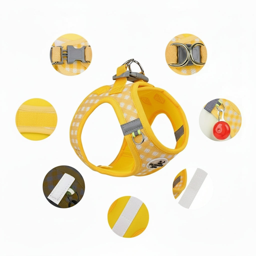 Detaljefoto af gul hundesele, justerbar med reflekterende striber og stærk spænde. Åndbar hvalpesele.