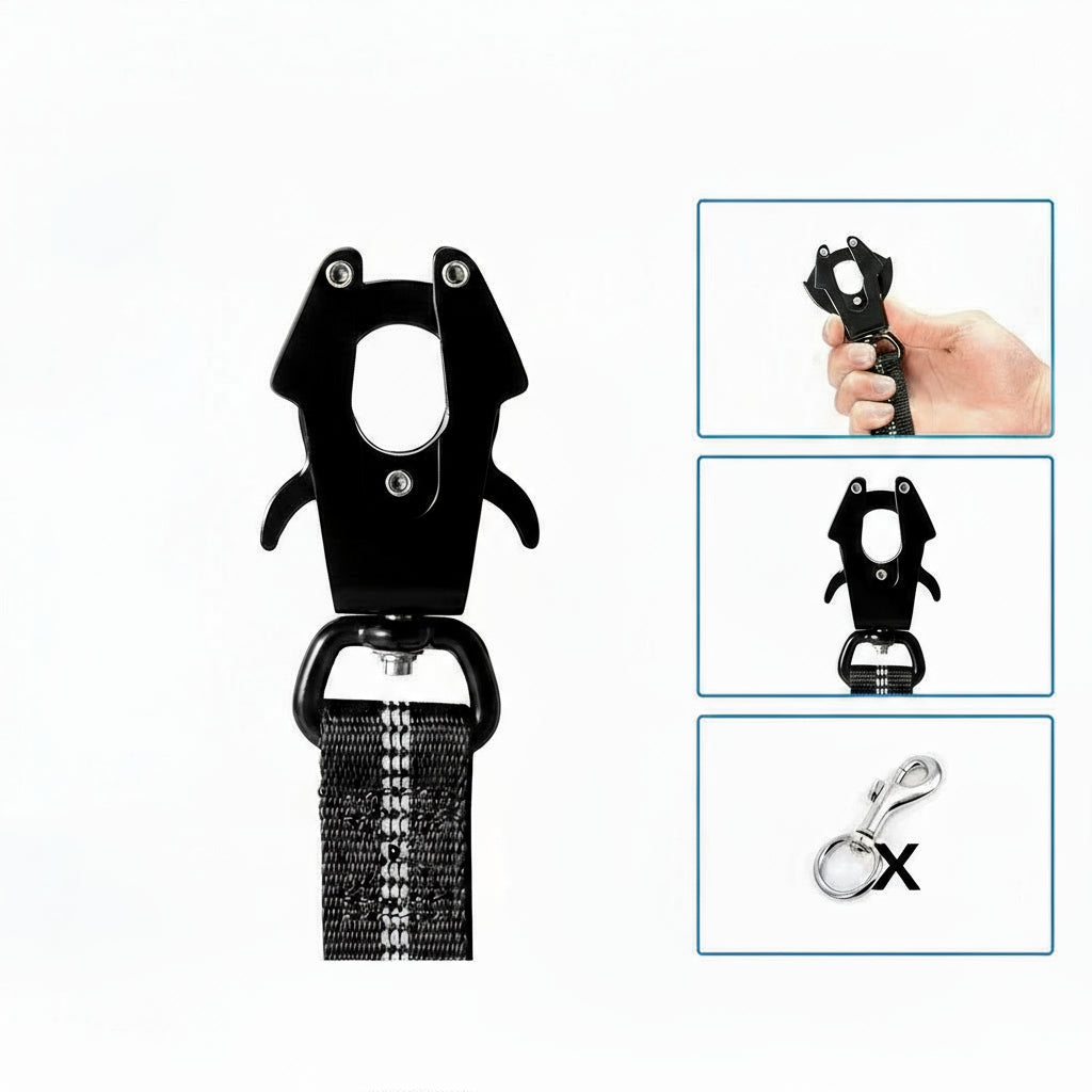Et nærbillede af en stor, sort, militær-stil karabinhage med to "tænder," fastgjort til en sort nylonrem med reflekterende striber. Højre side viser tre indsatser: en hånd der holder krogen, krogen set forfra, og et gennemskåret billede af en traditionel krog (markeret med et 'X' for at indikere en forskel eller erstatning).